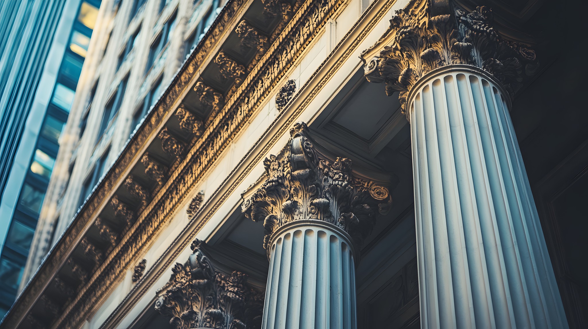 Ornate classical limestone columns and carved architectural detail